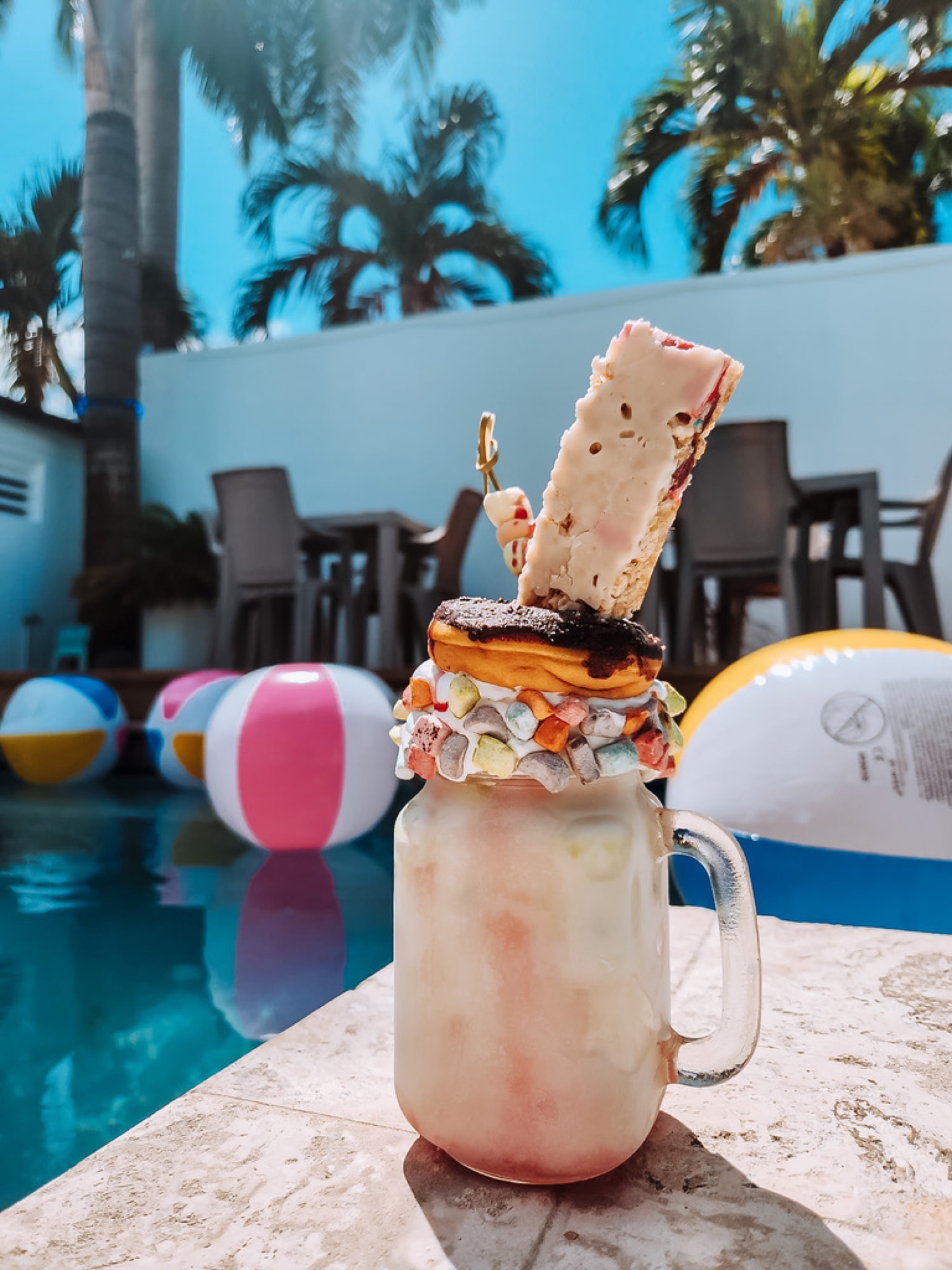 A Wabbles shake beside a tropical pool